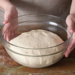 risen bread dough in a bowl