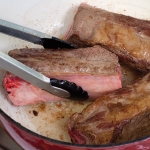 searing beef short ribs in a dutch oven
