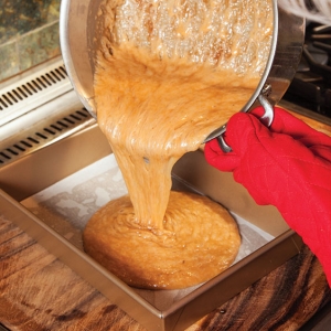 pouring caramel into a pan