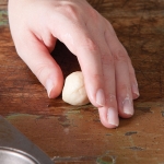shaping bread dough into rolls