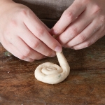 twisting bread dough into a spiral