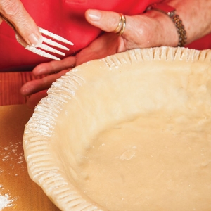 fork crimping around a pie crust
