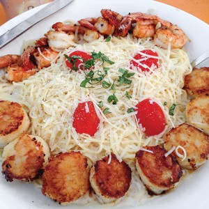 grilled shrimp and scallops with angel hair pasta at Coco's Sunset Grille, Tybee Island, Georgia