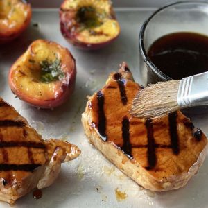 Luzianne Sweet Tea Brined Pork Chops with Grilled Peaches